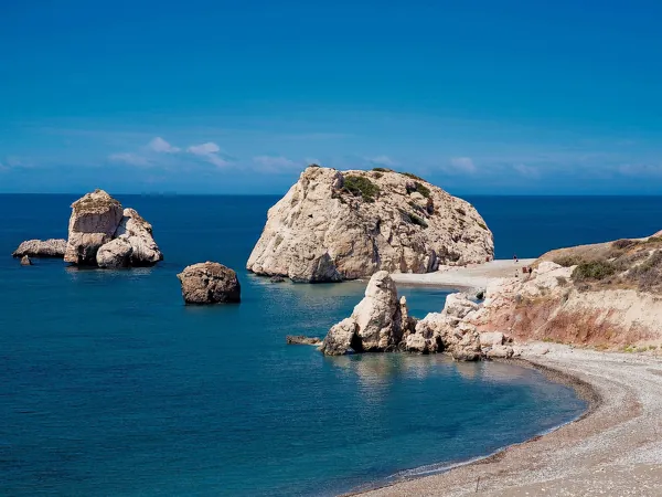 Petra tou Romiou and the pebble beach on a calm day