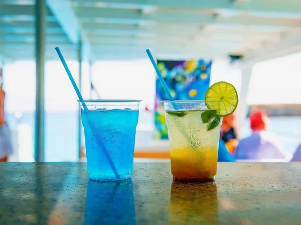 Two drinks on the bar counter on board