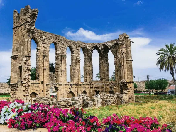 Ruined Gothic church arches with flowers in Famagusta