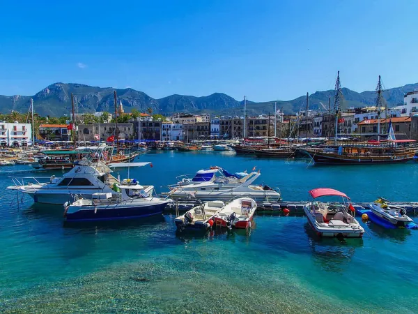 Boats in Kyrenia harbour below the mountains