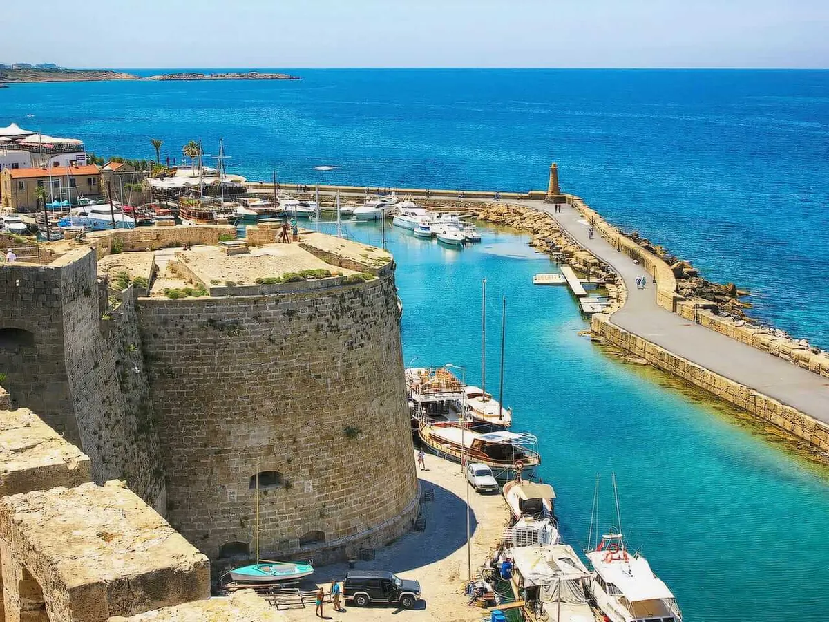 Kyrenia Castle walls beside the turquoise harbour