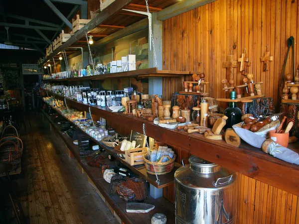Wooden shop counter with jars and olive-wood crafts