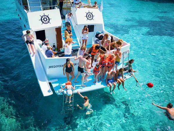 Passengers at the stern of the boat in the Blue Lagoon