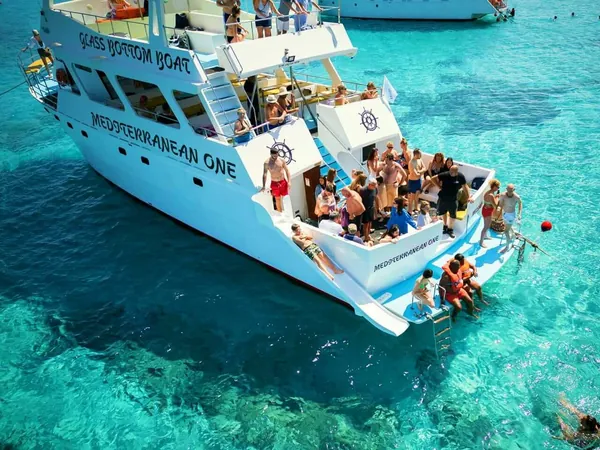 Swimmers using the waterslide at the back of the boat