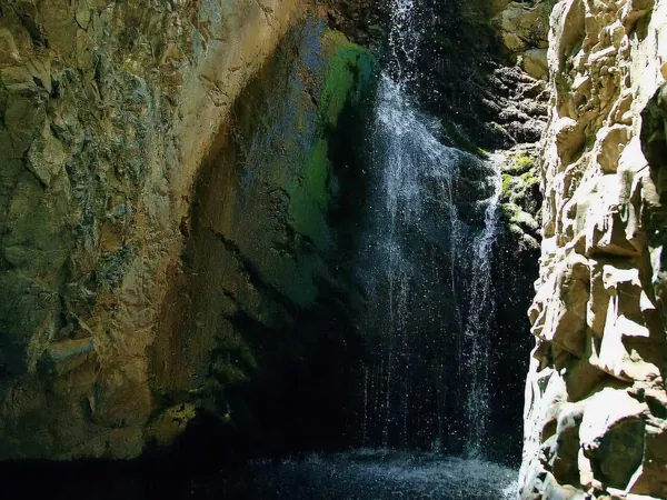 Millomeris waterfall falling down a rock face