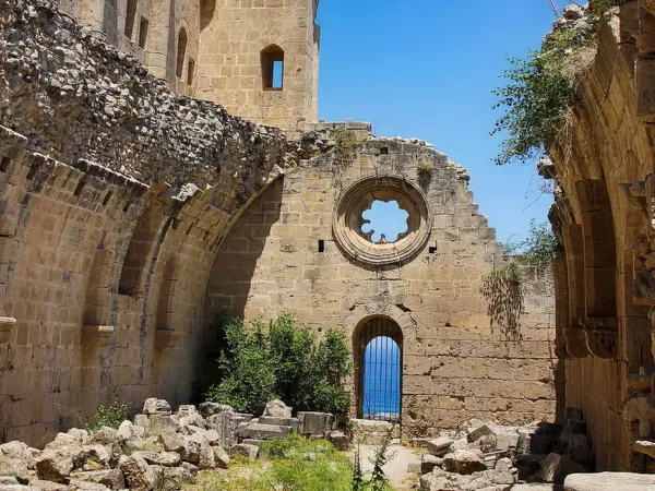 Ruined Gothic walls with a rose window at Bellapais