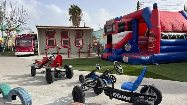 Outdoor pedal karts and inflatable play equipment at Kiddom