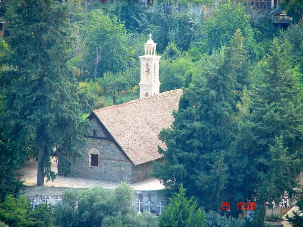 Agios Georgios church at Alona among cypress trees