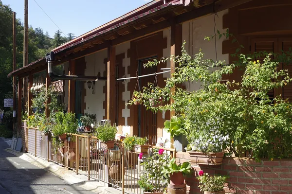 Traditional café with wooden balcony in Pedoulas