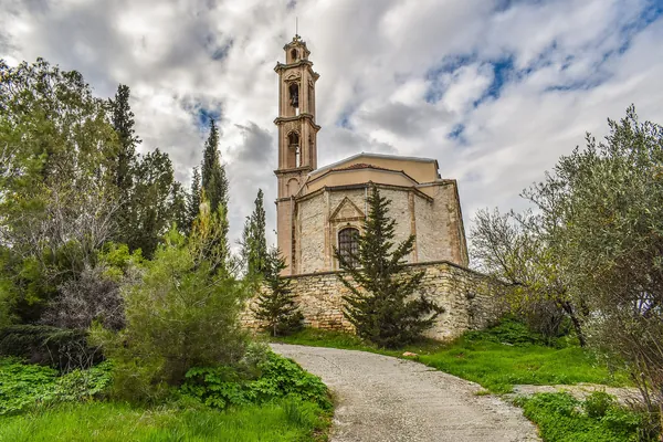 Stone church among cypress trees in Vavla